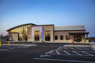 exterior front entrance of building at dusk