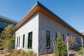 photo of the imprinted feather design on the side of the community center