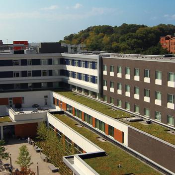 Wide aerial view of Higher Ground St. Paul with a blue sky and trees in the background