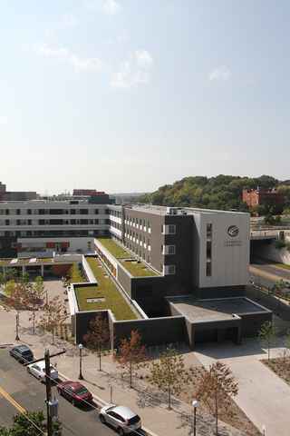 Wide aerial view of Higher Ground St. Paul with a blue sky and trees in the background