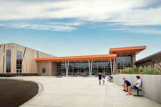 wide view of school entrance with kids