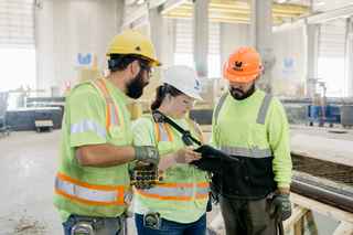 employees talking with eachother at wells manufacturing facility
