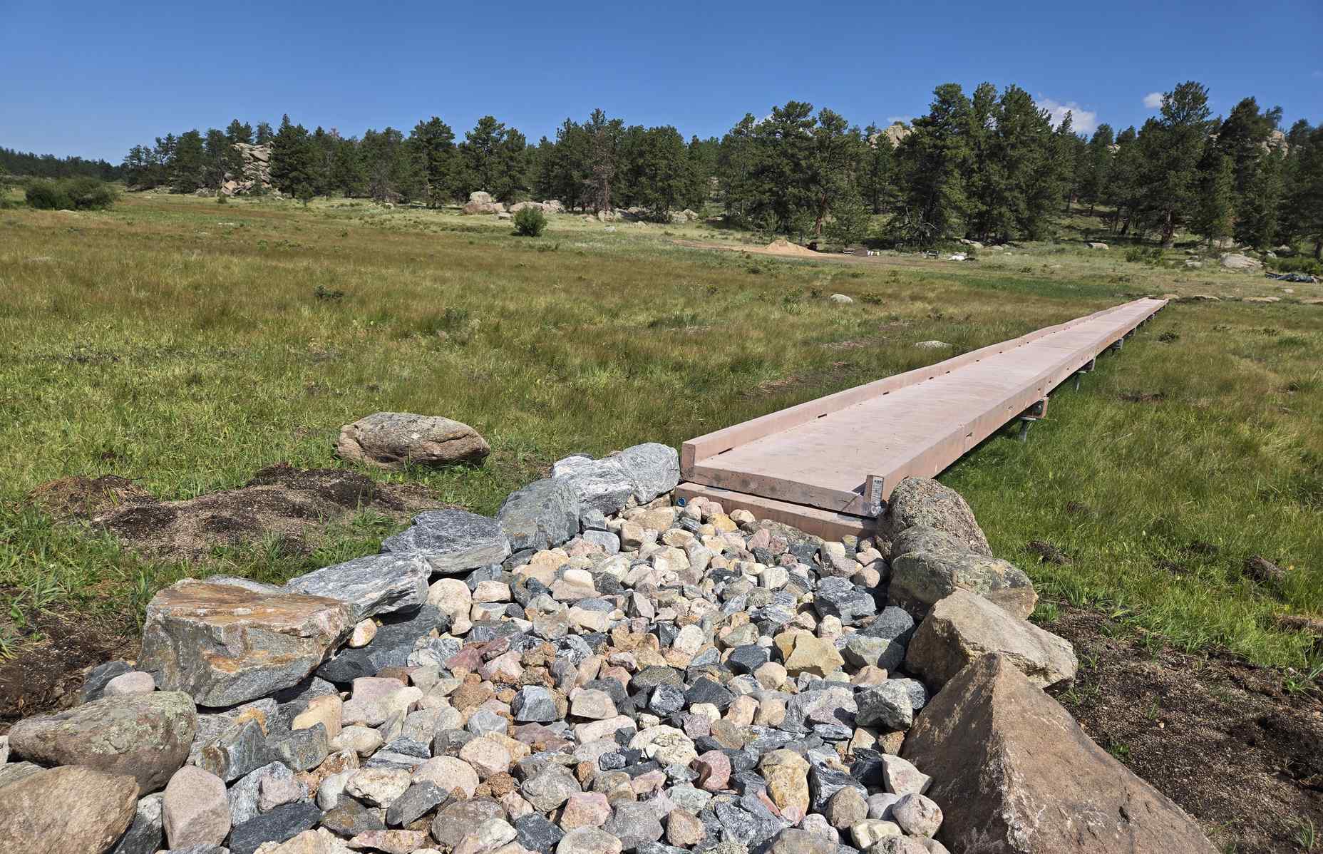 entrance to the lady moon boardwalk with stones