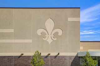 large school logo on side of school wall