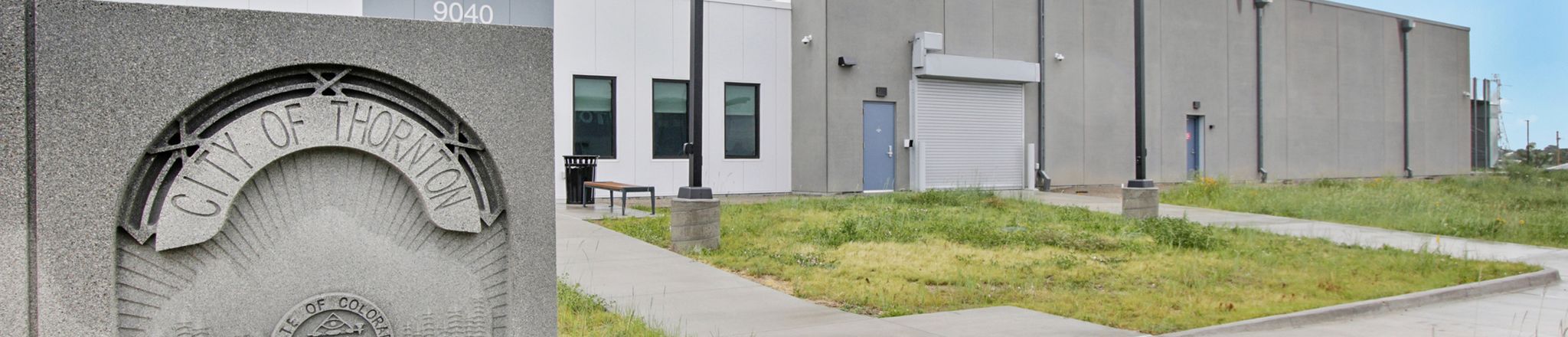 exterior of thornton police shooting range with badge sign
