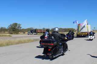 a veteran-owned motorcycle group escorting the first piece of column heading to the jobsite