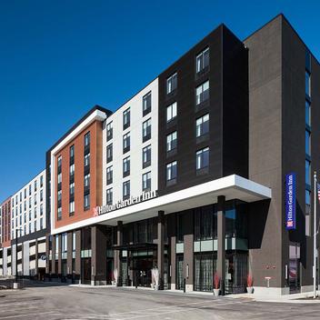 photo of Hilton hotel with sky in background