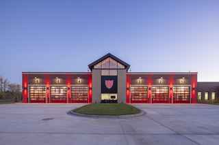 waconia fire station six-bay apparatus garage at night
