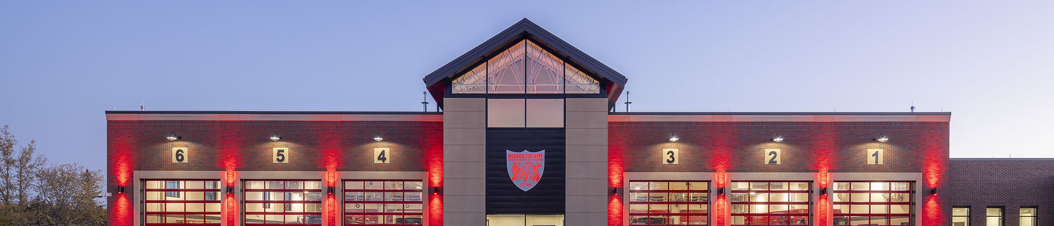 waconia fire station six-bay apparatus garage front lights on at night