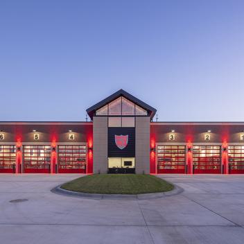 waconia fire station six-bay apparatus garage front lights on at night