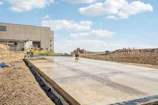 worker waterproofing a flooring