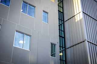 closeup of infinite facade panels on exterior of MOB