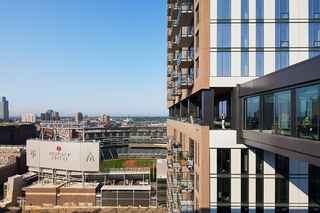 drone image of north loop green cladding with target field in background