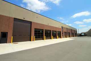 back side of Oshkosh Parks Department building showing garage doors