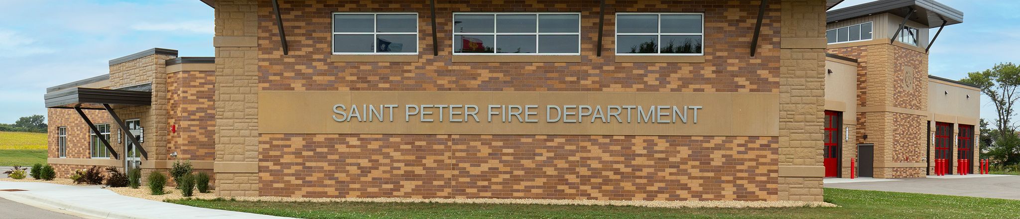 exterior of st peter fire station with truck bays