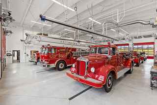 interior of st peter fire station truck bay with fire trucks