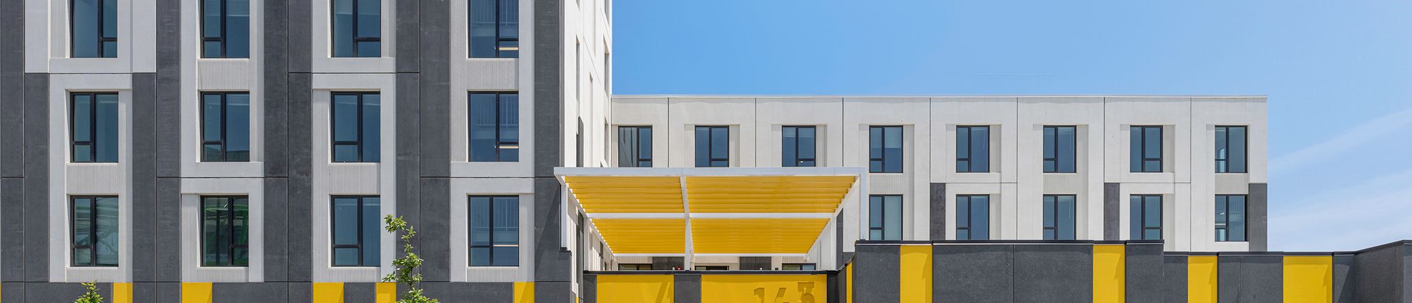entrance view of westhaven park station precast housing development in chicago