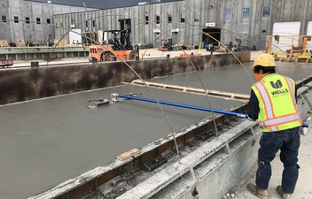 Wells employee finishing a panel