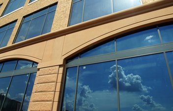 building with sky in window reflection